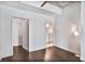 Bedroom featuring hardwood floors, large closet, and access to a full bathroom, exuding modern comfort at 44 Peachtree Ne Pl # 1929, Atlanta, GA 30309
