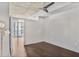 Bedroom with dark hardwood floors, a modern lamp, and walkout access to balcony at 44 Peachtree Ne Pl # 1929, Atlanta, GA 30309