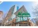 Modern building featuring a Publix store at the base of a high-rise residential tower, with glass balconies, and a brick facade at 44 Peachtree Ne Pl # 1929, Atlanta, GA 30309