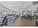 Modern gym features rows of treadmills, weight machines, and open floor space for various exercises at 44 Peachtree Ne Pl # 1929, Atlanta, GA 30309