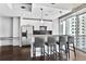 Kitchen area boasting stainless steel appliances, bar-top seating and city skyline views at 44 Peachtree Ne Pl # 1929, Atlanta, GA 30309