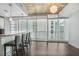 Living room area boasting bar-top seating, hardwood floors and city skyline views at 44 Peachtree Ne Pl # 1929, Atlanta, GA 30309
