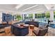 Expansive lounge area with a variety of seating options, a pool view, and stylish decor throughout at 44 Peachtree Ne Pl # 1929, Atlanta, GA 30309