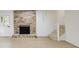 Finished basement with brick fireplace and access to the backyard at 605 Patrick Ne Pl, Sandy Springs, GA 30328