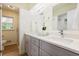 Bright bathroom with double sinks, granite countertops, and a separate shower at 605 Patrick Ne Pl, Sandy Springs, GA 30328