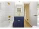This renovated bathroom features a modern vanity, white subway tile, and brass finishes at 605 Patrick Ne Pl, Sandy Springs, GA 30328