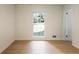 Cozy bedroom with ample natural light and a view of the green exterior at 605 Patrick Ne Pl, Sandy Springs, GA 30328