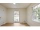 Bright bedroom with hardwood floors, ceiling fan, and updated windows offers a serene living space at 605 Patrick Ne Pl, Sandy Springs, GA 30328