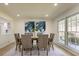 Dining room with seating for six, bright natural light, and modern décor at 605 Patrick Ne Pl, Sandy Springs, GA 30328