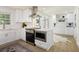 Bright kitchen features white cabinets, stainless steel appliances, and modern finishes at 605 Patrick Ne Pl, Sandy Springs, GA 30328