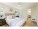 Comfortable bedroom with a queen bed, two windows, and a full bathroom at 605 Patrick Ne Pl, Sandy Springs, GA 30328