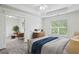 Bright primary bedroom offers a tray ceiling and an en-suite seating room with large windows at 655 Mead Se St # 58, Atlanta, GA 30312