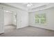 Spacious bedroom with neutral carpet, a ceiling fan, and natural light at 655 Mead Se St # 58, Atlanta, GA 30312