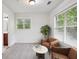 Bedroom showcasing large windows, neutral walls, carpet, and a bathroom at 655 Mead Se St # 58, Atlanta, GA 30312