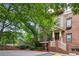 Two-story home with brick and siding exterior and front porch with manicured landscaping at 655 Mead Se St # 58, Atlanta, GA 30312