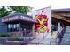 Killer Burgers Grindhouse restaurant with a colorful mural, inviting entrance, and outdoor seating area at 655 Mead Se St # 58, Atlanta, GA 30312