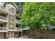 Multi-level condos feature private balconies, garage parking, and picturesque landscaping with mature trees at 655 Mead Se St # 58, Atlanta, GA 30312