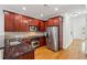 Modern kitchen boasting stainless steel appliances, granite countertops, and abundant cabinet storage at 655 Mead Se St # 58, Atlanta, GA 30312