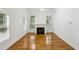 A well-lit living room showcases a fireplace and gleaming hardwood floors, ready for personalization at 655 Mead Se St # 58, Atlanta, GA 30312