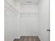 Walk-in closet with neutral carpet and metal shelves for storage at 655 Mead Se St # 58, Atlanta, GA 30312
