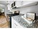 Granite counter tops complement stainless steel appliances in this fully-equipped kitchen with room to cook at 902 Ashton Oak Cir, Stone Mountain, GA 30083