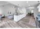 Open living space with island, eat-in kitchen, stainless appliances, sleek countertops and hardwood floors at 902 Ashton Oak Cir, Stone Mountain, GA 30083