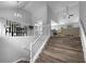 Bright staircase with railing leading to the second floor, with hardwood floors and views of the living space at 902 Ashton Oak Cir, Stone Mountain, GA 30083