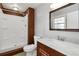 Bathroom with a combined shower and tub, a marble sink, and a classic mirror at 2142 Graystone Pkwy, Grayson, GA 30017