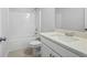 Bright white bathroom featuring tub and shower combo with modern vanity at 3293 Lions Ruby Ln, Atlanta, GA 30349