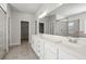 Bright bathroom featuring double sinks, a luxurious glass enclosed shower, and high end finishes at 3293 Lions Ruby Ln, Atlanta, GA 30349