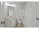 Bright bathroom with white cabinets, countertop, and tub/shower combo, offering a clean and modern design at 3293 Lions Ruby Ln, Atlanta, GA 30349