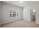 Bedroom features neutral colors, carpeting, and a window for natural light at 3293 Lions Ruby Ln, Atlanta, GA 30349