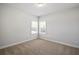 Bedroom with carpet and two windows for ample natural light at 3293 Lions Ruby Ln, Atlanta, GA 30349