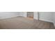 Bedroom with carpet leading to landing with a wood floor at 3293 Lions Ruby Ln, Atlanta, GA 30349