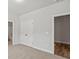 Neutral bedroom with carpeting and views to bathroom and living room at 3293 Lions Ruby Ln, Atlanta, GA 30349