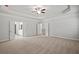 Large bedroom featuring plush carpeting, an attractive ceiling, and easy access to the en suite bathroom at 3293 Lions Ruby Ln, Atlanta, GA 30349