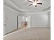 Expansive bedroom with plush carpeting, tray ceiling, and a ceiling fan for added comfort at 3293 Lions Ruby Ln, Atlanta, GA 30349