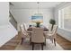 Elegant dining room with a chandelier, wood flooring, and comfortable seating at 3293 Lions Ruby Ln, Atlanta, GA 30349