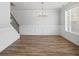 Stylish dining room featuring wood flooring, crown molding, and abundant natural light at 3293 Lions Ruby Ln, Atlanta, GA 30349