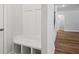 Mud room with white bench seat storage cubbies and hardwood floors at 3293 Lions Ruby Ln, Atlanta, GA 30349