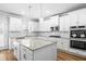 Modern kitchen with an island, granite counters, and stainless steel appliances at 3293 Lions Ruby Ln, Atlanta, GA 30349