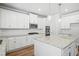 Stylish kitchen with white cabinets, stainless steel appliances, granite countertops and an island at 3293 Lions Ruby Ln, Atlanta, GA 30349