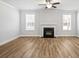 Open living space with a cozy fireplace and lots of natural light at 3293 Lions Ruby Ln, Atlanta, GA 30349