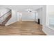Open living space with stairs to a second floor and a fireplace at 3293 Lions Ruby Ln, Atlanta, GA 30349