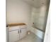 Bright bathroom with a tub shower and vanity awaiting a countertop at 4085 Sierra Vista Cir, Cumming, GA 30040