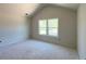 A bedroom with a high ceiling and large window lets in plenty of natural light at 4085 Sierra Vista Cir, Cumming, GA 30040