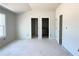 Bedroom with 2 closets and 2 additional doors, great for easy access throughout the home at 4085 Sierra Vista Cir, Cumming, GA 30040
