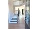 Spacious foyer featuring hardwood floors, elegant staircase, and natural light at 4085 Sierra Vista Cir, Cumming, GA 30040