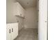 Laundry room with storage cabinets, patterned floor, and door at 4085 Sierra Vista Cir, Cumming, GA 30040