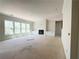 Spacious living room with fireplace, built-in cabinets, and large windows at 4085 Sierra Vista Cir, Cumming, GA 30040